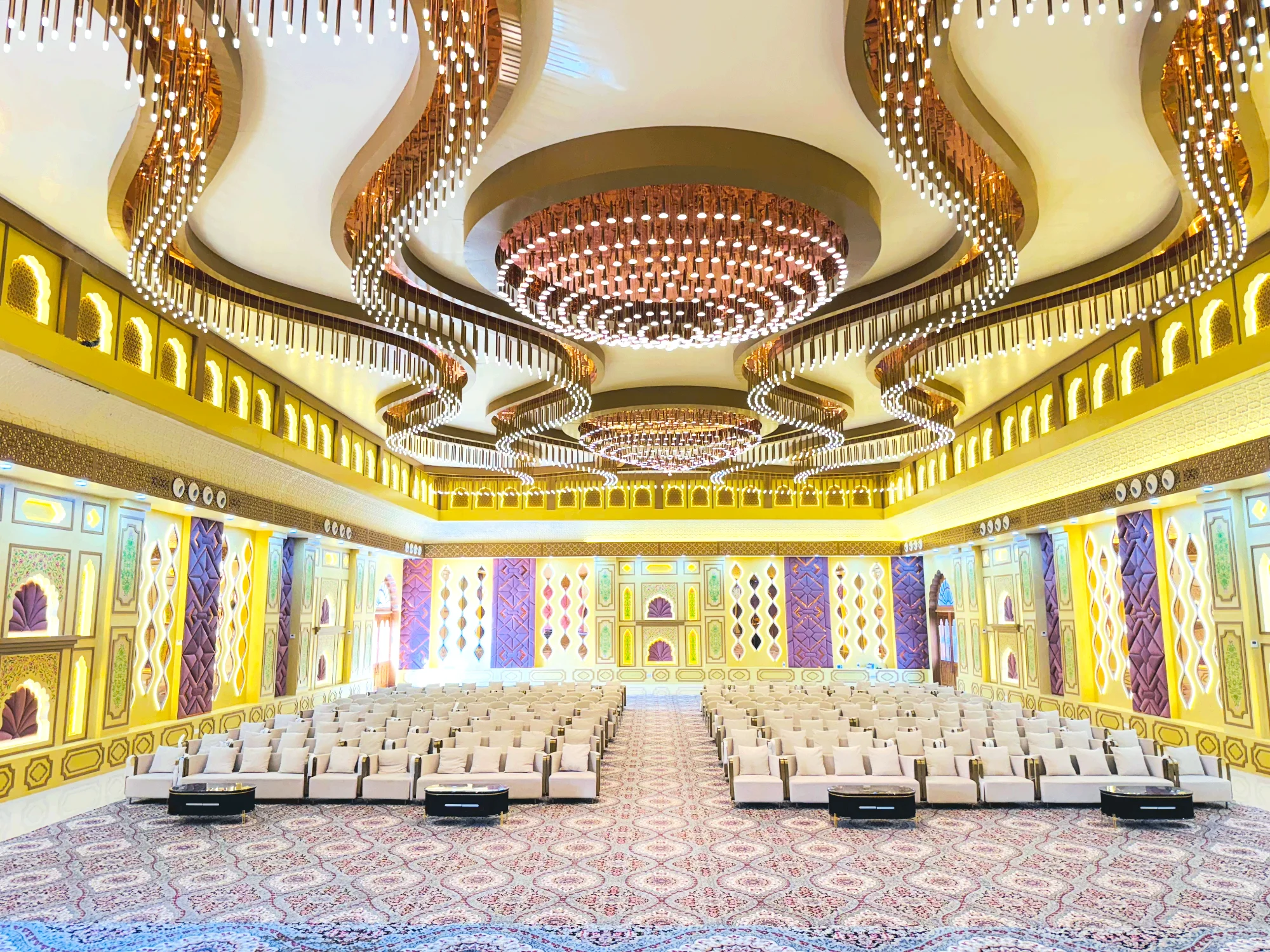 Harika Bagh conference hall in Jagatpura with rows of seating and chandelier lighting